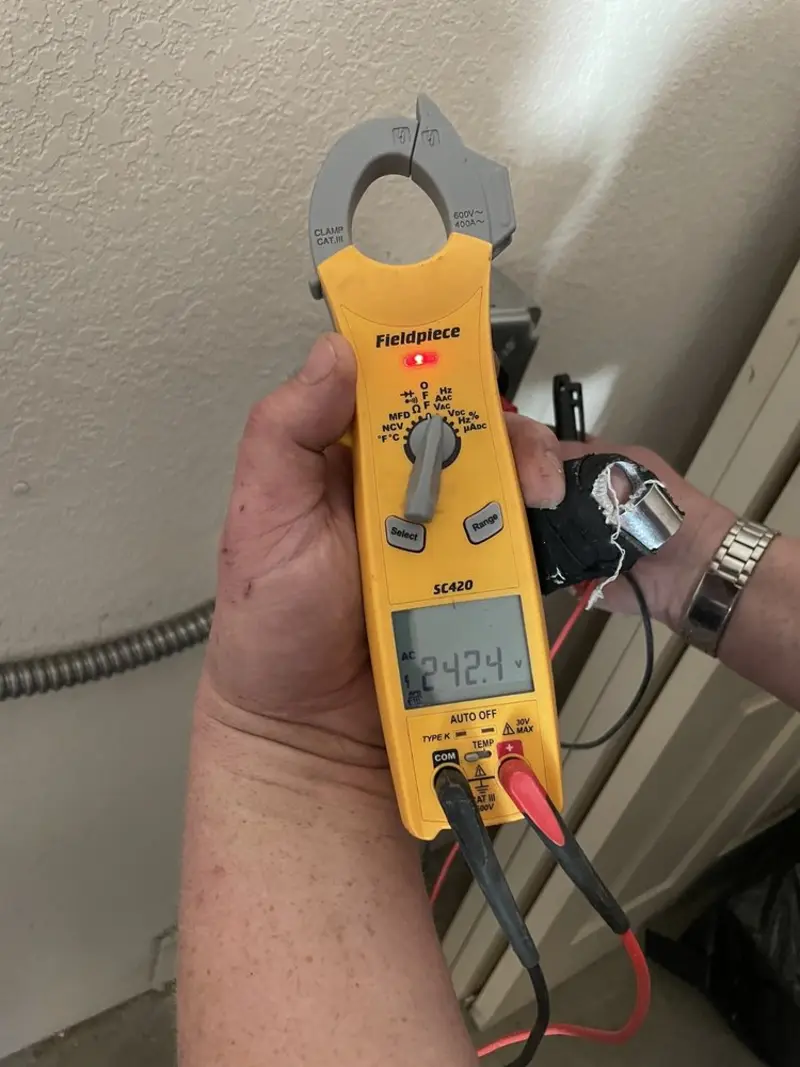 Voltage testing with clamp meter during Generator Installation in Normandy Park
